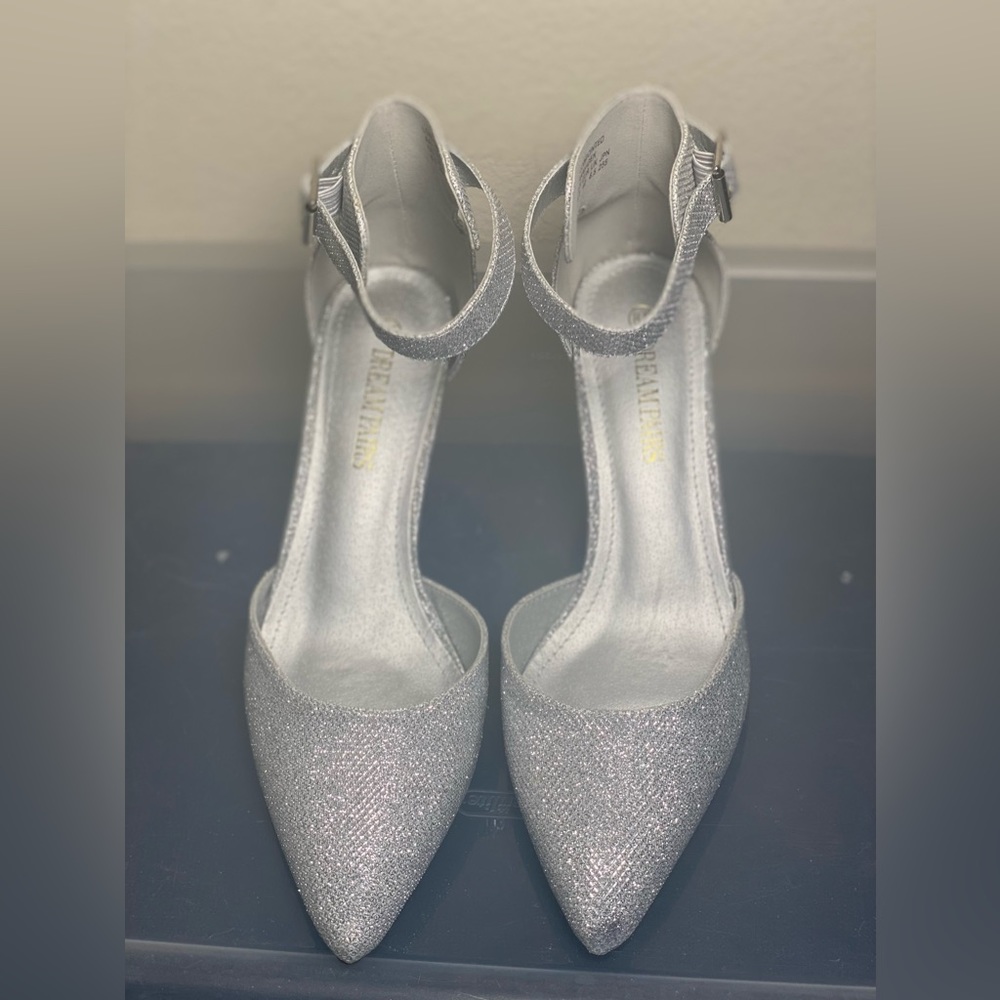 Brand new glittery silver heels. Never worn.